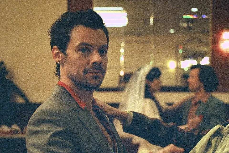 Harry Styles Waltzes His Way Through ‘Coming Up Roses’ Music Video